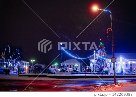 Night landscape of an amusement park car ride attraction with red lighting Night landscape of an amusement park car ride attraction with red lighting 142209388