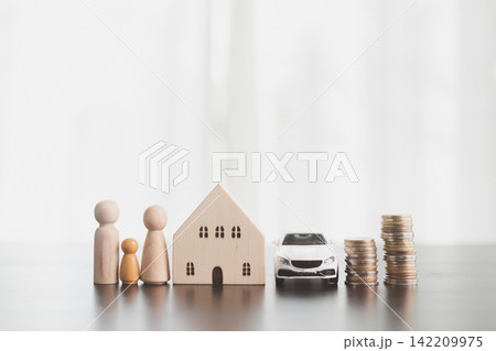 Family figures, wooden house, white model car, and rising coin stacks represent household savings, property and vehicle goals, mortgage planning, financial security, and long-term family prosperity. Family figures, wooden house, white model car, and rising coin stacks represent household savings, property and vehicle goals, mortgage planning, financial security, and long-term family prosperity. 142209975