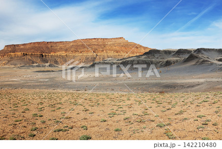 Desert Badlands Landscape with Mesas and Blue Sky Desert Badlands Landscape with Mesas and Blue Sky 142210480