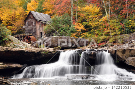 Autumn Waterfall and Rustic Grist Mill in Colorful Forest Autumn Waterfall and Rustic Grist Mill in Colorful Forest 142210533