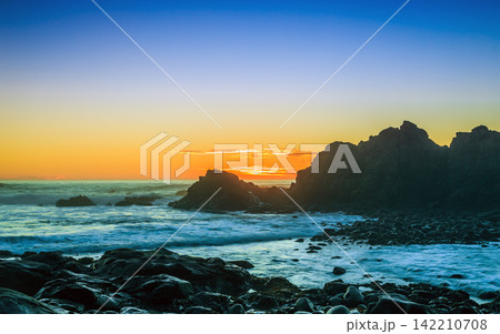 Rocky Ocean Coast at Sunset with Dramatic Seascape Rocky Ocean Coast at Sunset with Dramatic Seascape 142210708