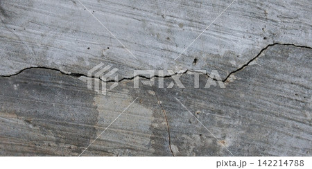 Cracked gray concrete surface texture Cracked gray concrete surface texture 142214788