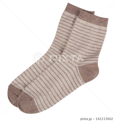 Pair of beige striped cotton socks isolated on white background. Casual striped knit hosiery with brown heel and toe Pair of beige striped cotton socks isolated on white background. Casual striped knit hosiery with brown heel and toe 142215602
