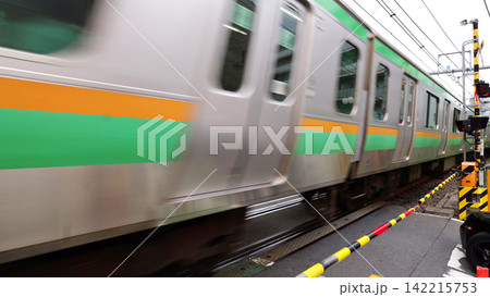Japanese Railway Crossing with Tracks, Warning Signals and Urban Buildings Japanese Railway Crossing with Tracks, Warning Signals and Urban Buildings 142215753