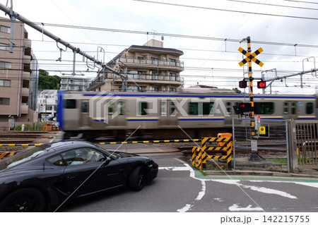 Japanese Railway Crossing with Tracks, Warning Signals and Urban Buildings Japanese Railway Crossing with Tracks, Warning Signals and Urban Buildings 142215755