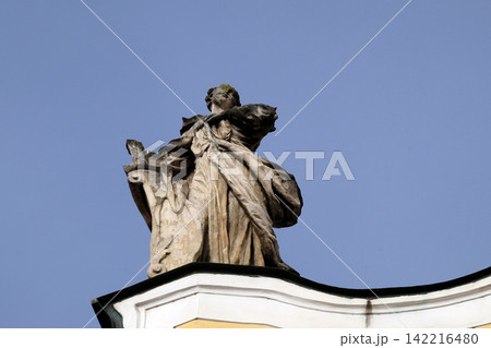 Angel on facade of Barmherzigenkirche church in Graz, Styria, Austria Angel on facade of Barmherzigenkirche church in Graz, Styria, Austria 142216480