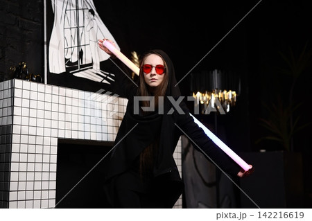 Caucasian woman in vibrant shades strikes pose in studio Caucasian woman in vibrant shades strikes pose in studio 142216619