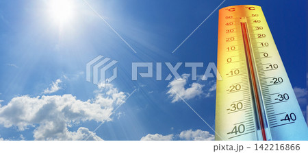 Thermometer showing high temperature under hot sunny sky Thermometer showing high temperature under hot sunny sky 142216866