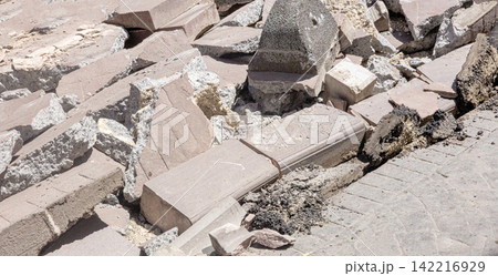 Concrete debris and broken paving blocks after earthquake disaster 142216929