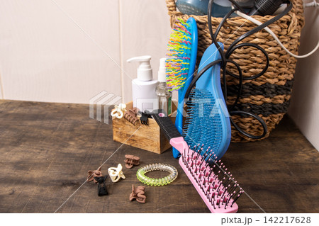 Combs and hair clips in the bathroom. Hair Styling Tools and Accessories on Table Combs and hair clips in the bathroom. Hair Styling Tools and Accessories on Table 142217628