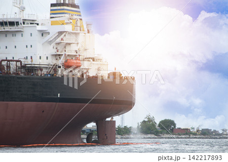 A large ocean-going vessel is docked for maintenance. 142217893