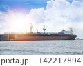 A large ocean-going vessel is docked for maintenance. 142217894