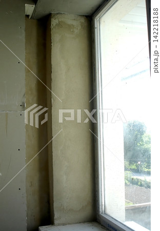 Unfinished Window Slope With Fresh Plaster Ready for Final Touches 142218188