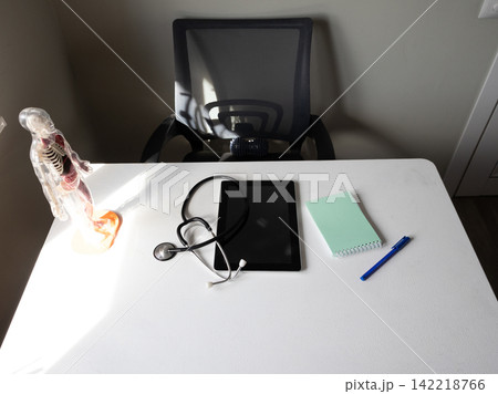 Transparent anatomical skeleton model with visible organs standing upright on stand Transparent anatomical skeleton model with visible organs standing upright on stand 142218766