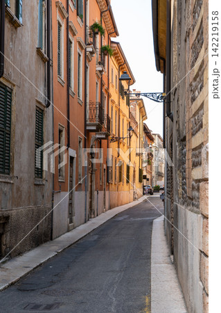 Narrow Street with Colorful Medieval Houses and Castel San Pietro View in Verona City Veneto Italy Narrow Street with Colorful Medieval Houses and Castel San Pietro View in Verona City Veneto Italy 142219158
