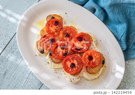 Elegant Caprese salad with mozzarella tomatoes king oyster mushrooms balsamic olive oil appetizer platter Elegant Caprese salad with mozzarella tomatoes king oyster mushrooms balsamic olive oil appetizer platter 142219459