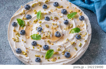Rustic No Bake Mascarpone Cheesecake Topped With Blueberries Pistachios Maple Syrup And Mint Rustic No Bake Mascarpone Cheesecake Topped With Blueberries Pistachios Maple Syrup And Mint 142219490