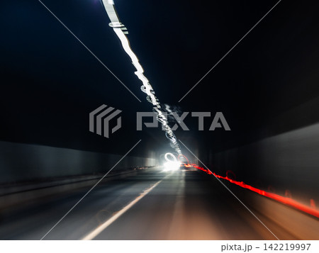 blurred light from headlights and lamps in tunnel blurred light from headlights and lamps in tunnel 142219997