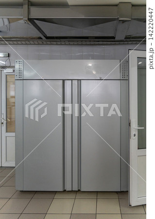 Large stainless steel industrial refrigerator with two doors Large stainless steel industrial refrigerator with two doors 142220447