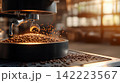 Modern Coffee Roasting Machinery with Beans Being Processed in an Industrial Setting 142223567