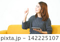 Asian woman using digital tablet shopping online, call, texting message internet technology lifestyle with smiling face. Asian woman touch smart tablet focus on hands using mobile app home office. 142225107