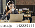 Women helpdesk call center use headphones talk to customer. Asian woman operator assistant customer service relationship agent. Businesswoman use laptop computer video call online meeting. 142225145