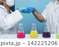 Two caucasian scientist men woman fist bump team partner shake hands together. Teamwork two scientist science chemistry research in laboratory. Close up hands pharmaceutical science team partnership 142225206