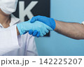 Two caucasian scientist men woman fist bump team partner shake hands together. Teamwork two scientist science chemistry research in laboratory. Close up hands pharmaceutical science team partnership 142225207