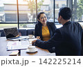 Happy success business woman partner working together in company office corporate executive teamwork. Meeting Executive Asian business woman using laptop office desk with fist arm raised win happiness 142225214