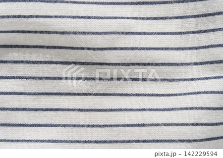 Beige Woven Fabric With Dark Blue Horizontal Stripes Filling Frame, Showing Regular Parallel Lines Beige Woven Fabric With Dark Blue Horizontal Stripes Filling Frame, Showing Regular Parallel Lines 142229594