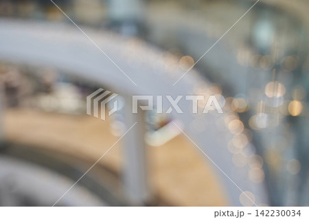 Spiral Staircase Railing Captured With Bokeh Lights In Soft Out Of Focus Interior Atrium Scene Spiral Staircase Railing Captured With Bokeh Lights In Soft Out Of Focus Interior Atrium Scene 142230034