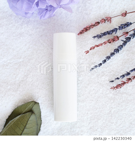 White Cylindrical Bottle Lying On Textured Towel With Dried Lavender Sprigs Purple Hydrangea 142230340