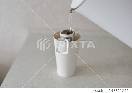 Kettle Pouring Water Into Cup Paper Pour Over Coffee Filter Brewing Inside White Disposable Cup Kettle Pouring Water Into Cup Paper Pour Over Coffee Filter Brewing Inside White Disposable Cup 142231292