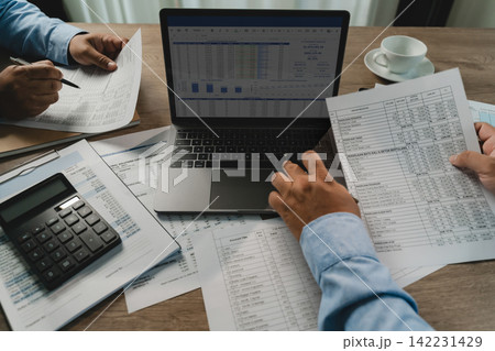 business meeting financial report financial reports around a laptop and calculator during a business meeting, showing data analysis, report checking, and accounting discussion report business meeting financial report financial reports around a laptop and calculator during a business meeting, showing data analysis, report checking, and accounting discussion report 142231429