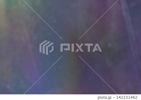 Muted Iridescent Panel Displaying Soft Multicolor Wash And Faint Vertical Streaks In Dim Ambient 142231462