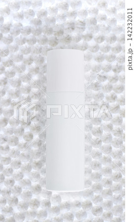 White Cosmetic Bottle Standing Upright On Textured Bubble Wrap Background With Soft Studio Lighting White Cosmetic Bottle Standing Upright On Textured Bubble Wrap Background With Soft Studio Lighting 142232011
