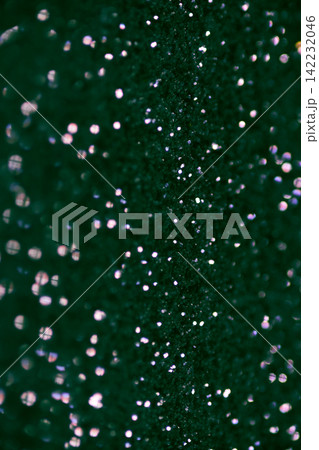 Green Glitter Particles Scattered And Sparkling On Dark Textured Surface Close Up Macro Bokeh Green Glitter Particles Scattered And Sparkling On Dark Textured Surface Close Up Macro Bokeh 142232046