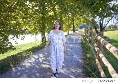 mature pregnancy with female traveler enjoying peaceful nature in green countryside mature pregnancy with female traveler enjoying peaceful nature in green countryside 142234397