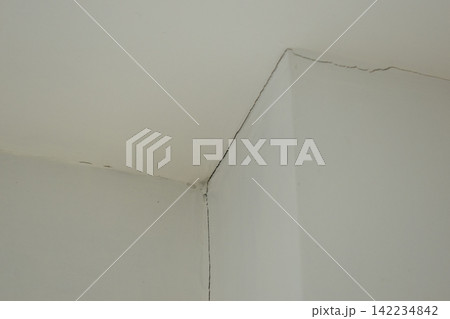 crack of pole on white wall from earthquake, construction industry crack of pole on white wall from earthquake, construction industry 142234842