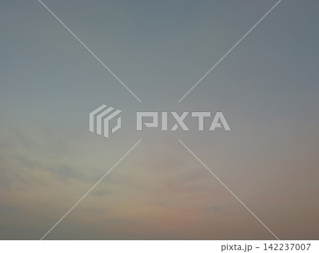 A collection of images featuring either a tranquil sky with soft pink and gray clouds or a dramatic field fire with bright orange flames and thick smoke. A collection of images featuring either a tranquil sky with soft pink and gray clouds or a dramatic field fire with bright orange flames and thick smoke. 142237007