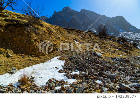 Rugged Mountain Landscape with Snow and Rocky Terrain Rugged Mountain Landscape with Snow and Rocky Terrain 142239377
