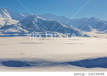 Vast Snowy Mountain Landscape in Kyrgyzstan 142239449