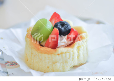 cheesecake with fruit topping or basque cheesecake with fruit topping, piece of cake cheesecake with fruit topping or basque cheesecake with fruit topping, piece of cake 142239778
