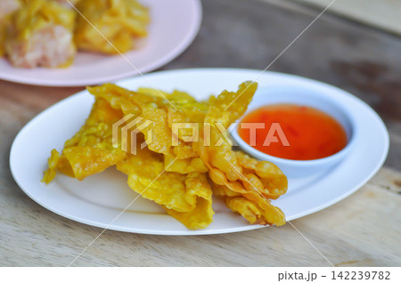 fried wonton, deep fried wonton or fried dumpling or deep fried dumpling and dip fried wonton, deep fried wonton or fried dumpling or deep fried dumpling and dip 142239782