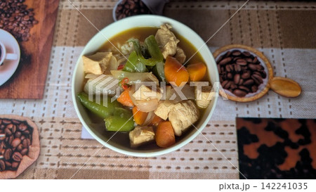 Chicken and vegetable soup curry served in a bowl Chicken and vegetable soup curry served in a bowl 142241035