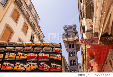 Colorful lisbon tram souvenirs with historic backdrop Colorful lisbon tram souvenirs with historic backdrop 142243462