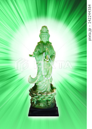 front view antique green statue of Guanyin (Goddess of Mercy) set against green radial background, religion, object, buddha, chinese, decor, copy space front view antique green statue of Guanyin (Goddess of Mercy) set against green radial background, religion, object, buddha, chinese, decor, copy space 142244384