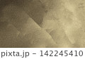Abstract Grainy Platinum Gold and Bronze Texture Background with Soft Plaster Strokes 142245410