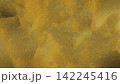 Abstract Grainy Golden and Antique Bronze Texture Background with Elegant Watercolor Spots 142245416