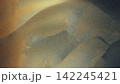Abstract Grainy Platinum and Bronze Texture Background with Cold Grey Slate Waves 142245421